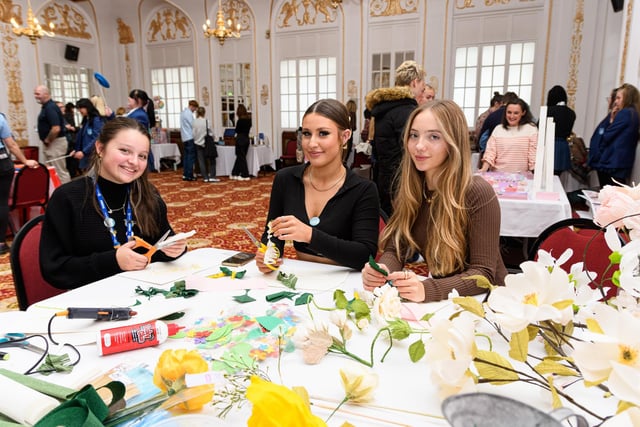 Left to right: Sasha Karadzhinova, Isabel Laird and Sienna Baggaley try out some flower arranging at Blackpool's Winter Gardens Creative Cultural Careers Event