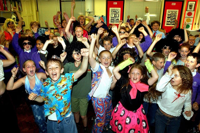 Centenary celebrations at Thames Primary School. Year five pupils enjoying a '70's party