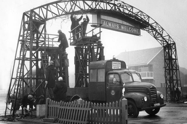Down it comes...workmen demolish the famous Welcome Arch at the south end of Blackpool Promenade in January 1969