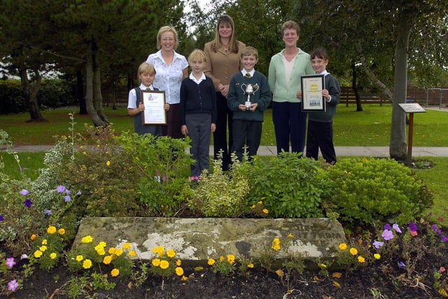 Lytham CE Primary School won several awards for their garden. Pictured in the garden are pupils (left to right) Fiona Quarmby, Maddie Leivers, Greg Anderton, and Olivia Thompson, with staff Sue Waby, head Nicola Worrad, and Sue Mohan