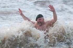 Royal Marines join veteran and 4x cancer survivor Tim Crossin in taking a series of cold water plunge in the sea at Cleveleys. Photo: Kelvin Stuttard