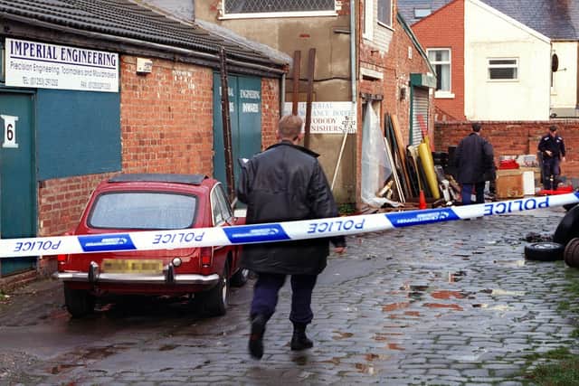 Police officers at the scene of the murder, at Back Eaves Street, Blackpool.