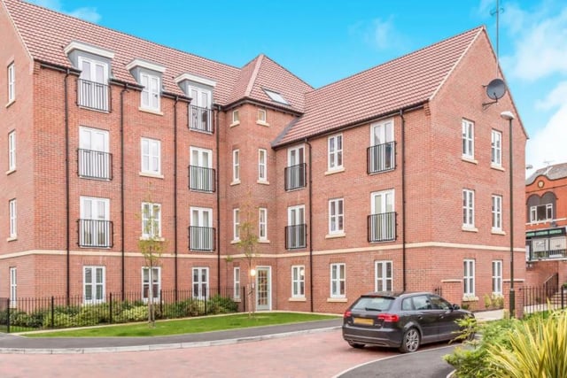This two bedroom flat is part of a larger complex and is worth £100,000.