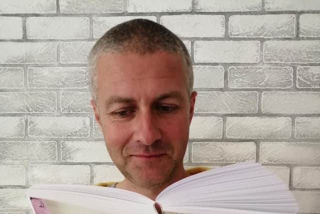 Jay Fortune with his newly published book All Fall Down