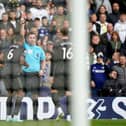 Arsenal's Gabriel is shown a red card by referee Chris Kavanagh during the Premier League match at Elland Road.