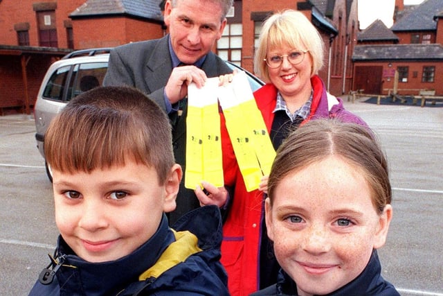 Thames Primary School pupils Elaine Mills (9) and Daniel Chorlton (8) with their Glow Power reflective armbands. Also pictured are Moorland Motor's Jackie Wild and Councillor Roy Fisher who had responsibilty for road safety