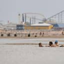 People enjoy the warm weather on the Blackpool Beach (Photo by Anthony Devlin/Getty Images)