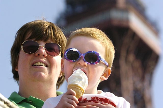 Two year old Matthew Hodgson, sporting his shades, enjoys ice cream in the sunshine with mum Karole, 2004