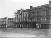 A view of properties on Central Promenade. Left to right - The Huntsman Hotel (originally The Trocadero), a glimpse of Fairyland (where roller skating is advertised) , the Wellington Hotel and amusement arcade