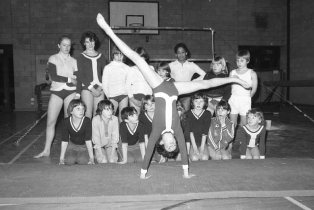 The world may watch the Russian and Romanian gymnasts and gasp in wonder and admiration. But the Garstang gymnasts have a lot more fun. Garstang Gymnasts Club is a typical example of the many clubs which have sprung up around the country and is run by a team of dedicated volunteers. Pictured: Eleven-year-old Laura Bolton demonstrates a cartwheel to the other members of the club