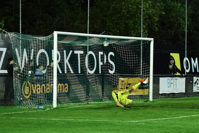 Nick Haughton scores his and Fylde's second goal from the penalty spot in Tuesday's FA Cup replay win at Farsley Celtic  Picture: STEVE MCLELLAN