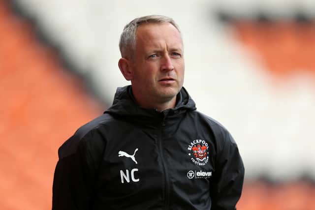 BLACKPOOL, ENGLAND - OCTOBER 10: Neil Critchley, manager of Blackpool looks on during the Sky Bet League One match between Blackpool and Ipswich Town at Bloomfield Road on October 10, 2020 in Blackpool, England. Sporting stadiums around the UK remain under strict restrictions due to the Coronavirus Pandemic as Government social distancing laws prohibit fans inside venues resulting in games being played behind closed doors. (Photo by Lewis Storey/Getty Images)