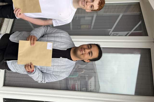 Lukas Sheridan and Kaelon Rutherford celebrate their results at St George's High School, Blackpool.