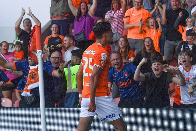 Theo Corbeanu celebrates scoring the late equaliser with Blackpool's jubilant fans