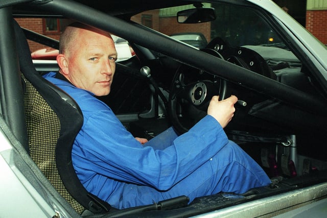 TVR worker Barry Gillett inside the new TVR Cerbera speed 12 which was the world's fastest production car