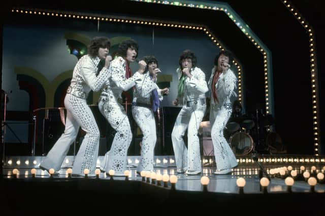 The Osmonds on stage at the London Palladium in the 70s. Picture: Getty Images.