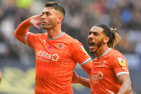 Gary Madine and Dom Thompson celebrate the former’s goal in Blackpool’s last game before the World Cup break at Wigan Athletic