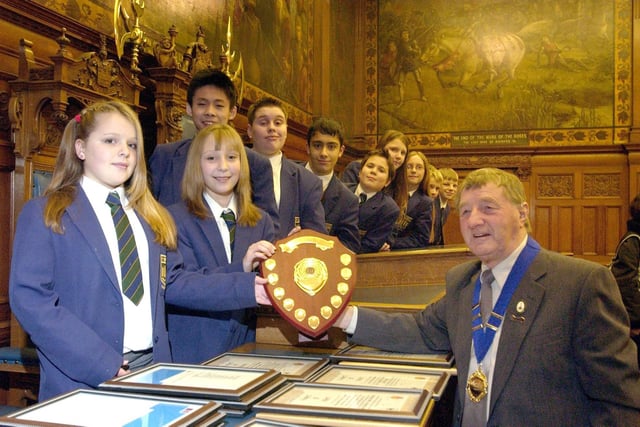 The Blackpool Civic Trust Awards Ceremony at Blackpool Town Hall. Civic Trust chairman Tom Lowe presents pupils from Highfield High school with the senior conservation award