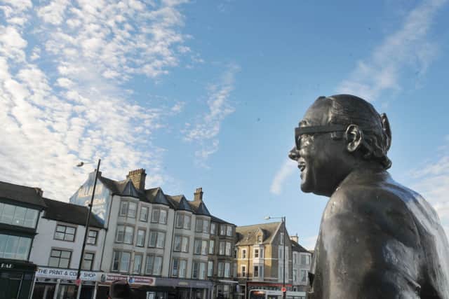 They come from far and wide to strike a pose with the Eric Morecambe statue which was unveiled by the Queen in 1999.