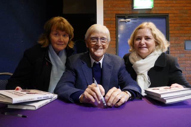 Sir Michael Parkinson signs books for fans Margaret Sellick (left) and Geraldine Bromley, both from St Annes, at Lowther Pavilion in 2018. Photo: John Sellick