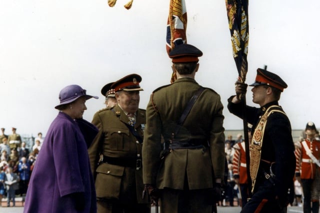 Queen Elizabeth presents the Weeton tropp with their new colours in 1990
