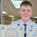 Harry Ellis with his certificates