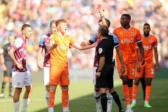 Keith Stroud showed a straight red card to Sonny Carey