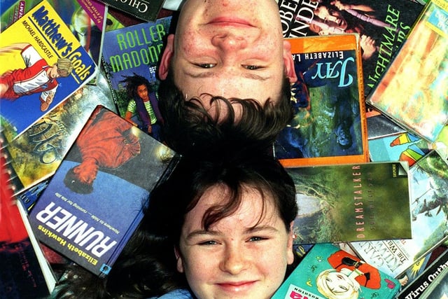 Robert Coleman of Palatine High School, Blackpool immersed in his reading with Jenny Riley of St. Bede's RC High School, 1998