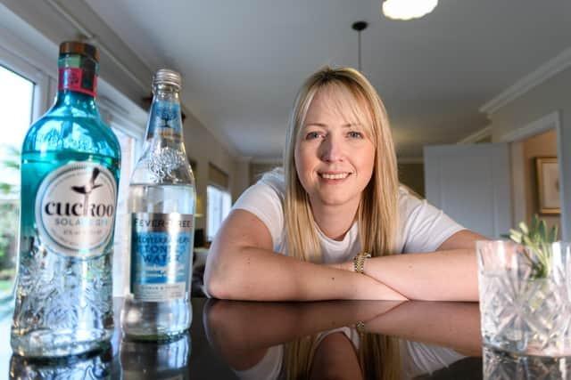 Post reporter Catherine Musgrove pictured with the award-winning Cuckoo Gin which made at Holmes Farm, Sandy Lane in Chorley using fresh spring water, natural ingredients and a passion for hard work. Holmes Farm has been in the Singleton family for over 100 years. The inspiration to add a distillery into the mix came one day as the family sat unwinding together after a long day on the farm, enjoying G&T’s.