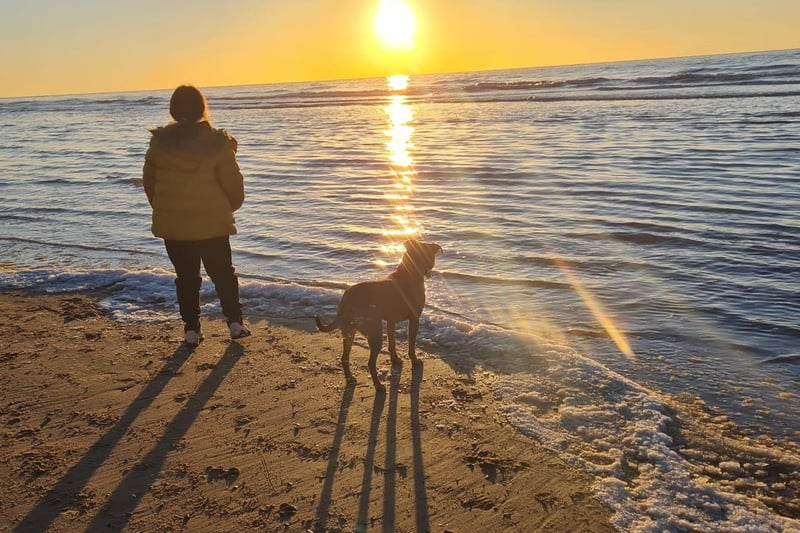 My daughter and our dog looking towards the beautiful Blackpool December sun