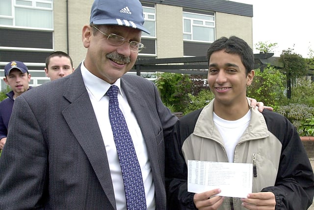 Sandepan Chakraverti who arrived from India nine months earlier, is congratulated by Principal Jeff Holland (wearing Sandepan's hat)