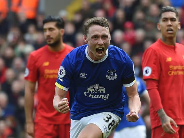 Everton's English defender Matthew Pennington celebrates after scoring their first goal during the English Premier League football match between Liverpool and Everton at Anfield in Liverpool, north west England on April 1, 2017.