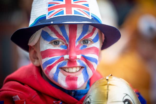 This boy has his face painted for the occasion