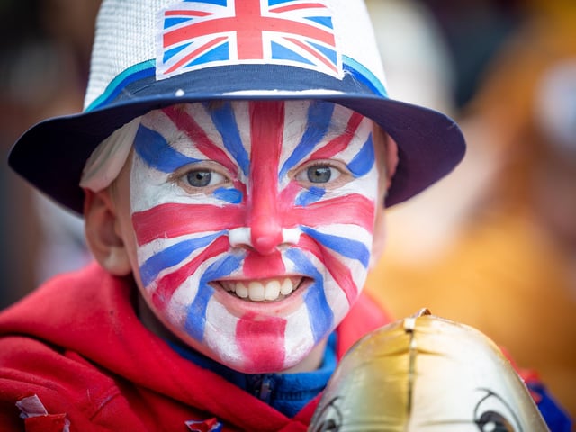 This boy has his face painted for the occasion