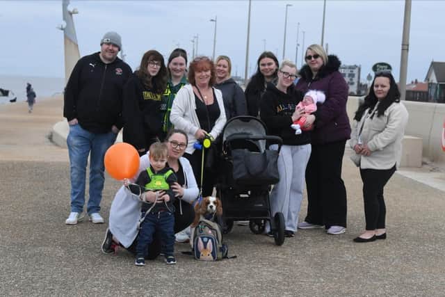 Two-year-old Oscar Peachy walked a mile along the seafront with his family to raise money for Trinity Hospice in memory of his dad Chris who died last year