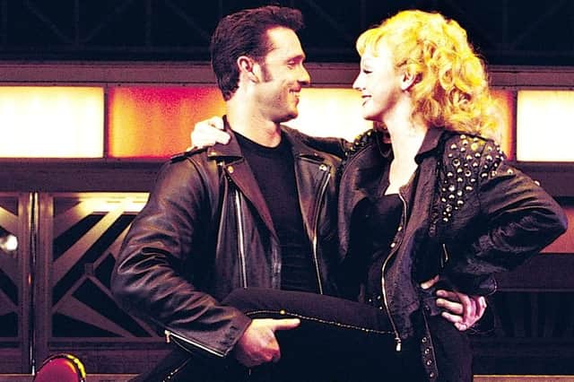 Danny and Sandy played by Craig Urbani and Haley Flaherty in a stage version of Grease at The Grand Theatre in 2002