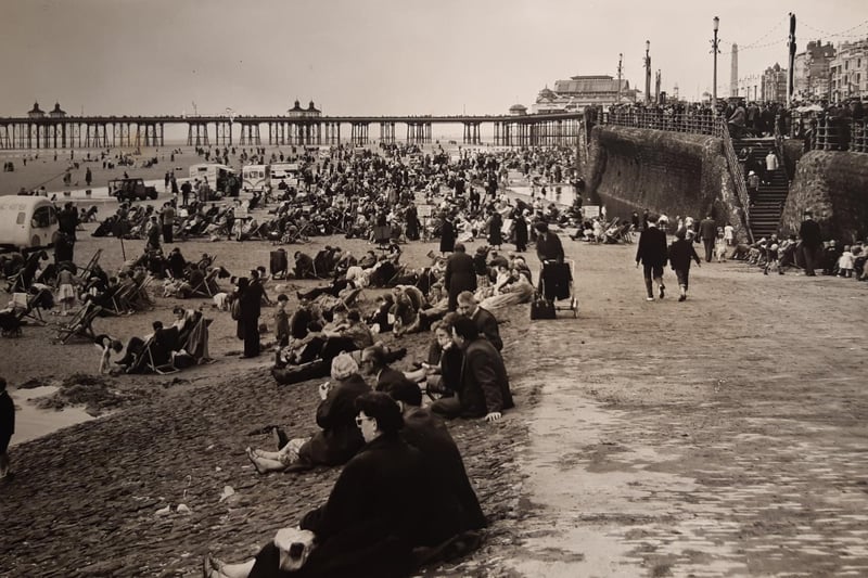 The caption on the back of this 1957 picture says: "The Whitsuntide weather was not too kind to holidaymakers in the North West but it could not dampen the spirits of those who had their minds set on going to the coast"