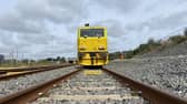 An autumn treatment train parked in sidings at Wigan