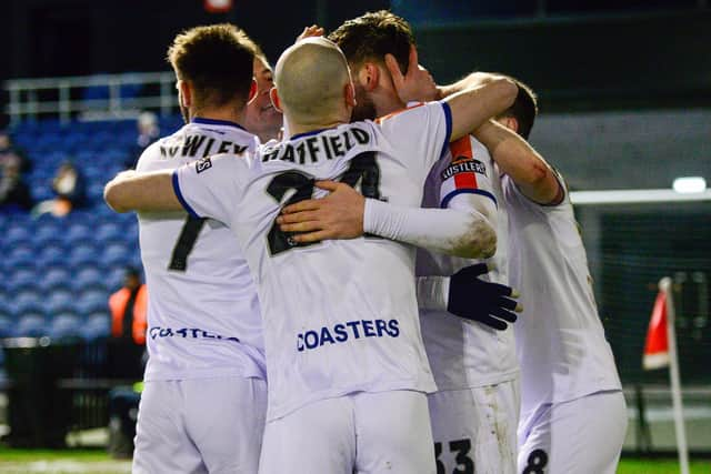 AFC Fylde celebrate Pierce Bird's winning goal against Buxton on Tuesday  Picture: STEVE MCLELLAN