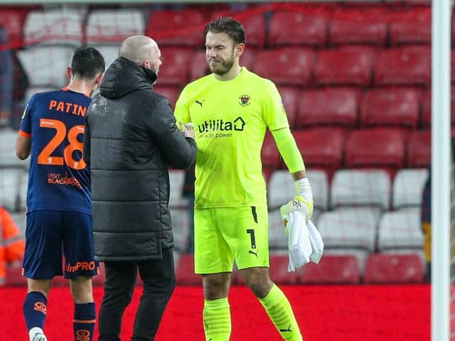 Michael Appleton shakes Chris Maxwell’s hand after the match