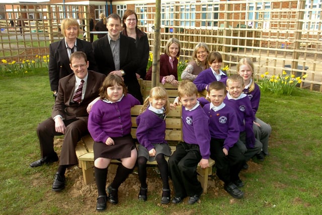 Pupils of Stanley Primary School, Blackpool, pictured at the bench and tree dedicated to the memory of their former headteacher Teresa Ireland. Also pictured are colleagues and members of Mrs Ireland's family including sons Martin (left) and David