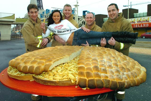Giant chip butty made at Coral Island, Blackpool. Miss Blackpool Sally Hempel measures up against the huge snack with (from left) firefighters Kevin Turner, Dave Rainford, Darren Ferneyhough, and Paul Hunter