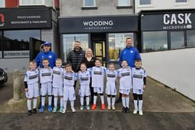 Wooding Opticians team with the Under 7 Sonics team outside the practice