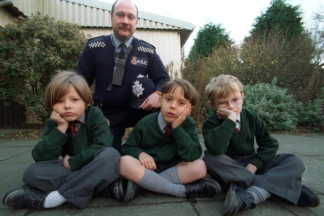 Those in this 1996 picture from Moor Park Primary School might remember why this photo was taken. PC Colin Howorth is with Zachary Adams, Joshua Quinn and Alistair Taylor who are forced to sit on the floor after benches they raised money for were stolen