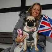 Katie Collins and dog Ella enjoy the Coronation After Party, in celebration of King Charles III, held at Fairhaven Lake, Lytham St Annes.