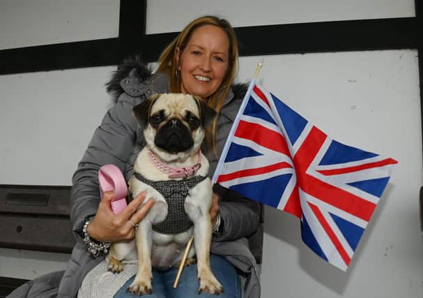 Katie Collins and dog Ella enjoy the Coronation After Party, in celebration of King Charles III, held at Fairhaven Lake, Lytham St Annes.
