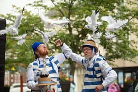 Fishmongers Cliff and Nestor with their seagulls in Market Square.