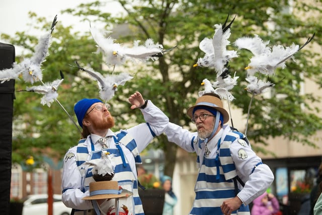 Fishmongers Cliff and Nestor with their seagulls in Market Square.