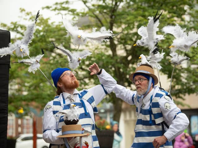 Fishmongers Cliff and Nestor with their seagulls in Market Square.
