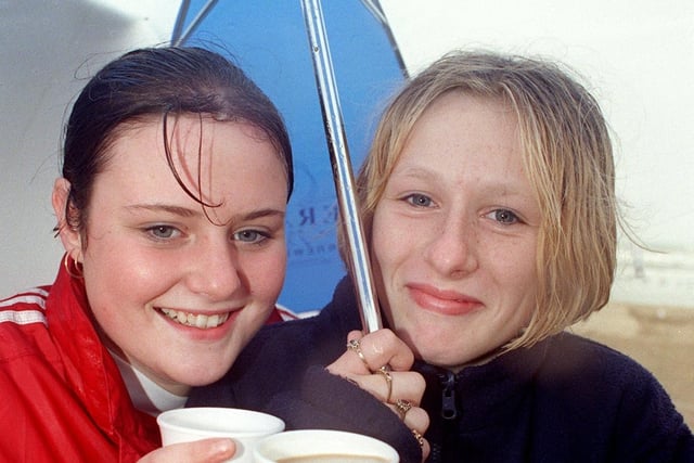 Paula Robinson (left) and Gemma Allen waiting in the rain for their favourite group All Saints